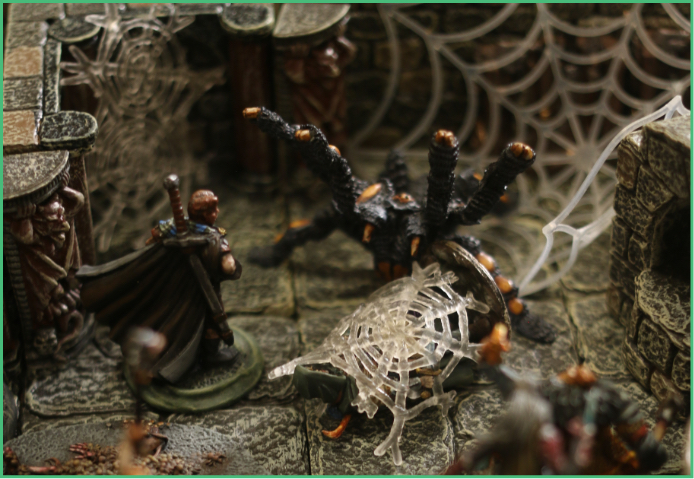 Image of D and D characters fighting giant spider